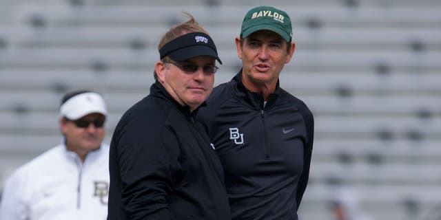 Nov 30, 2013; Fort Worth, TX, USA; TCU Horned Frogs head coach Gary Patterson and Baylor Bears head coach Art Briles before the game at Amon G. Carter Stadium. The Bears defeated the Horned Frogs 41-38. Mandatory Credit: Jerome Miron-USA TODAY Sports