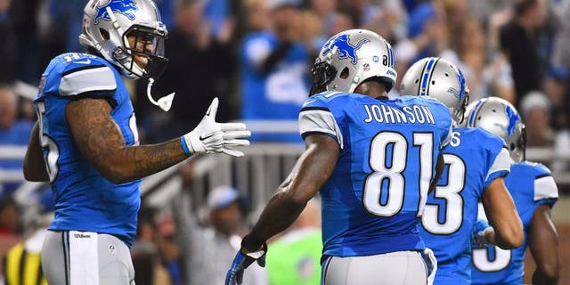 Dec 3, 2015; Detroit, MI, USA; Detroit Lions tight end Eric Ebron (85) celebrates his touchdown with wide receiver Calvin Johnson (81) during the first quarter against the Green Bay Packers at Ford Field. Mandatory Credit: Tim Fuller-USA TODAY Sports