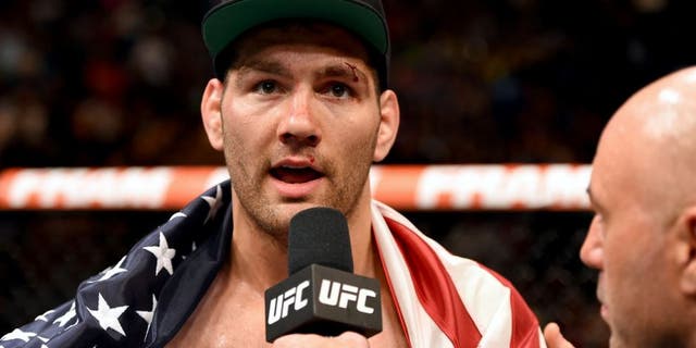 LAS VEGAS, NV - MAY 23: Chris Weidman speaks with Joe Rogan after his UFC middleweight championship bout during the UFC 187 event at the MGM Grand Garden Arena on May 23, 2015 in Las Vegas, Nevada. (Photo by Josh Hedges/Zuffa LLC/Zuffa LLC via Getty Images)