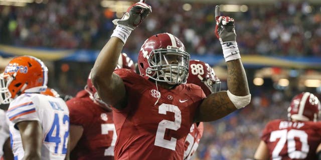 Dec 5, 2015; Atlanta, GA, USA; Alabama Crimson Tide running back Derrick Henry (2) celebrates his 2 yard touchdown run in the second quarter against the Florida Gators in the 2015 SEC Championship Game at the Georgia Dome. Mandatory Credit: Butch Dill-USA TODAY Sports