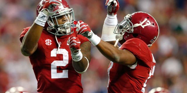 TLANTA, GA - DECEMBER 5: Running back Derrick Henry #2 of the Alabama Crimson Tide celebrates with running back Kenyan Drake #17 of the Alabama Crimson Tides after scoring a second quarter touchdown against the Florida Gators during the SEC Championship at the Georgia Dome on December 5, 2015 in Atlanta, Georgia. (Photo by Kevin C. Cox/Getty Images)