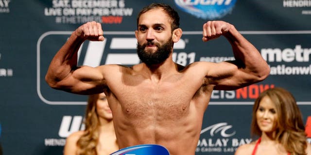 LAS VEGAS, NV - DECEMBER 05: Johny Hendricks poses on the scale after weighing in during the UFC 181 weigh-in inside the Mandalay Bay Events Center on December 5, 2014 in Las Vegas, Nevada. (Photo by Josh Hedges/Zuffa LLC/Zuffa LLC via Getty Images)