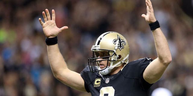 NEW ORLEANS, LA - DECEMBER 06: Drew Brees #9 of the New Orleans Saints celebrates after his team makes a 2 point conversion against the Carolina Panthers at Mercedes-Benz Superdome on December 6, 2015 in New Orleans, Louisiana. (Photo by Sean Gardner/Getty Images)