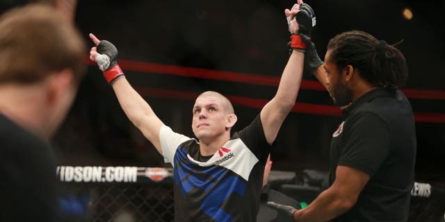 CHICAGO, IL - JULY 25: Joe Lauzon celebrates after defeating Takanori Gomi in their lightweight bout during the UFC event at the United Center on July 25, 2015 in Chicago, Illinois. (Photo by Rey Del Rio/Zuffa LLC/Zuffa LLC via Getty Images)