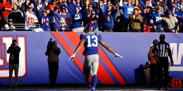 EAST RUTHERFORD, NJ - DECEMBER 06: Odell Beckham Jr. #13 of the New York Giants celebrates after scoring a 72 yard long touchdown against the New York Jets at MetLife Stadium on December 6, 2015 in East Rutherford, New Jersey. (Photo by Al Bello/Getty Images)