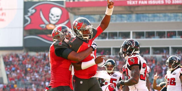 TAMPA, FL - DECEMBER 06: Jameis Winston #3 of the Tampa Bay Buccaneers reacts after scoring a touchdown during the first quarter of the game against the Atlanta Falcons at Raymond James Stadium on December 6, 2015 in Tampa, Florida. (Photo by Rob Foldy/Getty Images)