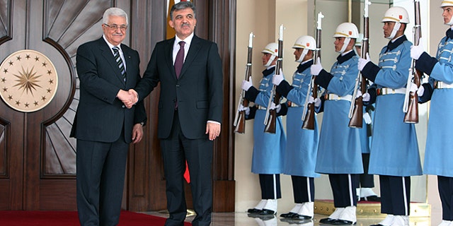 Palestinian leader Mahmoud Abbas, left, and Turkish President Abdullah Gul pose for media cameras before their meeting at the Cankaya Palace in Ankara, Turkey.