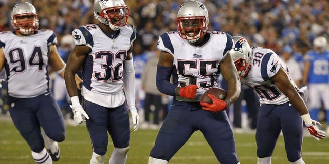 New England Patriots outside linebacker Akeem Ayers (55) celebrates his interception against the San Diego Chargers during the second half in an NFL football game Sunday, Dec. 7, 2014, in San Diego. (AP Photo/Lenny Ignelzi)