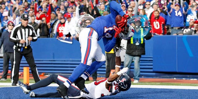 Dec 6, 2015; Orchard Park, NY, USA; Buffalo Bills wide receiver Sammy Watkins (14) makes a catch for a touchdown as Houston Texans strong safety Kevin Johnson (30) defends during the first quarter at Ralph Wilson Stadium. Mandatory Credit: Kevin Hoffman-USA TODAY Sports
