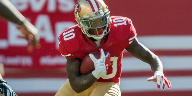 Nov 2, 2014; Santa Clara, CA, USA; San Francisco 49ers wide receiver Bruce Ellington (10) returns a punt for a gain against the St. Louis Rams during the first quarter at Levi's Stadium. Mandatory Credit: Ed Szczepanski-USA TODAY Sports