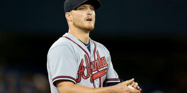 TORONTO, CANADA - APRIL 19: Shelby Miller #17 of the Atlanta Braves rubs up a baseball in the sixth inning during MLB game action against the Toronto Blue Jays on April 19, 2015 at Rogers Centre in Toronto, Ontario, Canada. (Photo by Tom Szczerbowski/Getty Images)