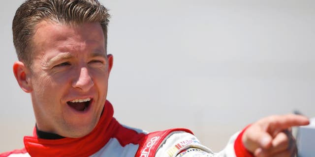 AJ Allmendinger, driver of the #47 Kroger/Hungry Jack Chevrolet, stands on the grid during qualifying for the NASCAR Sprint Cup Series GEICO 500 at Talladega Superspeedway on May 2, 2015 in Talladega, Alabama. (Photo by Matt Sullivan/Getty Images)