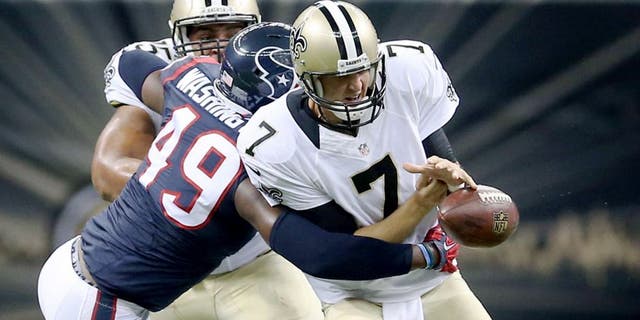 Aug 30, 2015; New Orleans, LA, USA; Houston Texans outside linebacker Tony Washington (49) knocks the football away from New Orleans Saints quarterback Luke McCown (7) in the second quarter of their game at the Mercedes-Benz Superdome. Mandatory Credit: Chuck Cook-USA TODAY Sports