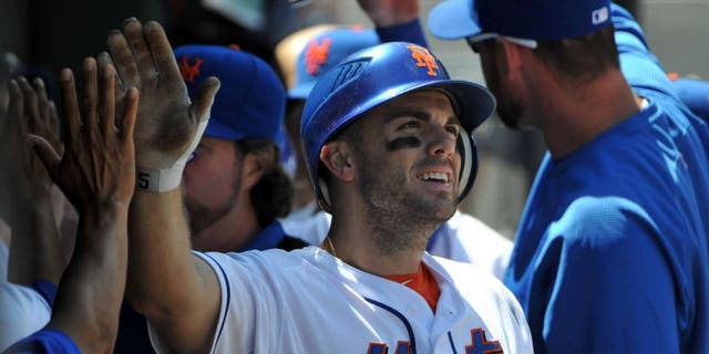 NEW YORK, NY - AUGUST 11: David Wright #5 of the New York Mets is congratulated after scoring on a double by Lucas Duda #21 of the New York Mets (not pictured) in the bottom of the third inning against the San Diego Padres at Citi Field on August 11, 2011 in the Flushing neighborhood of the Queens borough of New York City. (Photo by Christopher Pasatieri/Getty Images)