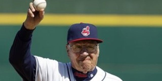March 6: Hall of Fame pitcher Bob Feller waves to the fans before throwing out a ceremonial first pitch before a spring training baseball game between the Cincinnati Reds and Cleveland Indians in Goodyear, Ariz.