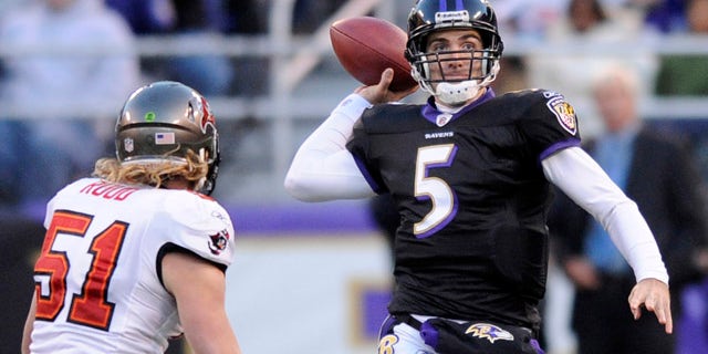 Nov. 28: Baltimore Ravens quarterback Joe Flacco (5) throws a pass while being pressured byTampa Bay Buccaneers linebacker Barrett Ruud (51) during the first half of an NFL football game in Baltimore.