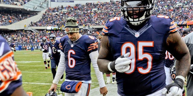 Nov 16, 2014; Chicago, IL, USA; Chicago Bears quarterback Jay Cutler (6) and Chicago Bears defensive tackle Ego Ferguson (95) at half-time during their game against the Minnesota Vikings at Soldier Field. The Bears won 21-13. Mandatory Credit: Matt Marton-USA TODAY Sports
