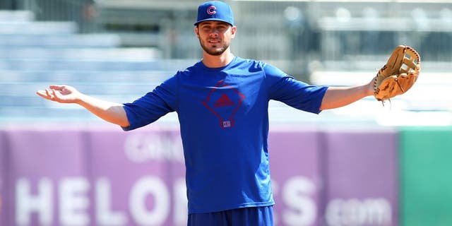Sep 15, 2015; Pittsburgh, PA, USA; Chicago Cubs third baseman Kris Bryant (17) reacts during infield practice before playing the Pittsburgh Pirates at PNC Park. Mandatory Credit: Charles LeClaire-USA TODAY Sports
