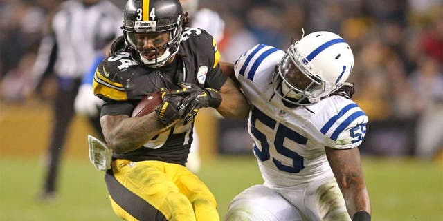 Dec 6, 2015; Pittsburgh, PA, USA; aPittsburgh Steelers running back DeAngelo Williams (34) runs gainst Indianapolis Colts inside linebacker Nate Irving (55)during the fourth quarter at Heinz Field. The Steelers won 45-10. Mandatory Credit: Charles LeClaire-USA TODAY Sports