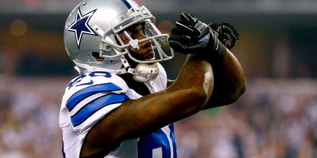 ARLINGTON, TX - DECEMBER 21: Dez Bryant #88 of the Dallas Cowboys celebrates his touchdown reception against the Indianapolis Colts in the first half at AT&T Stadium on December 21, 2014 in Arlington, Texas. (Photo by Tom Pennington/Getty Images)