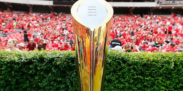 ATHENS, GA - SEPTEMBER 27: The College Football Playoff National Championship Trophy is seen on the field prior to the game between the Georgia Bulldogs and the Tennessee Volunteers at Sanford Stadium on September 27, 2014 in Athens, Georgia. (Photo by Kevin C. Cox/Getty Images)