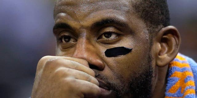 New York Knicks' Amar'e Stoudemire sits on the bench after he got into foul trouble during the second half of an NBA basketball game against the San Antonio Spurs, Wednesday, Dec. 10, 2014, in San Antonio. San Antonio won 109-95. (AP Photo/Eric Gay)