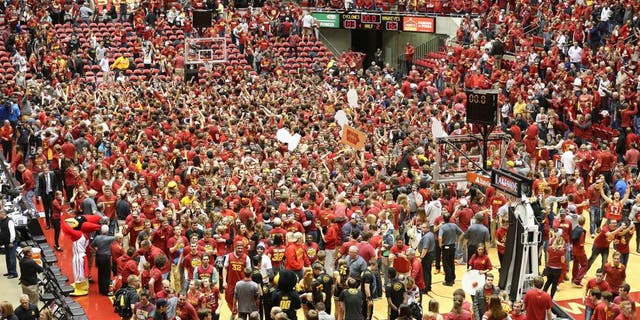 Dec 10, 2015; Ames, IA, USA; Iowa State Cyclones students rush the court after beating the Iowa Hawkeyes at James H. Hilton Coliseum. The Cyclones beat the Hawkeyes 83-82. Mandatory Credit: Reese Strickland-USA TODAY Sports
