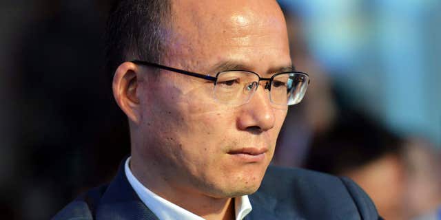 In this June 25, 2015 photo, Guo Guangchang attends the opening ceremony of the new Internet bank MYbank in Hangzhou in east China's Zhejiang province.