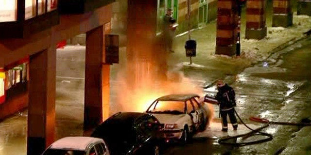 Dec. 11: In this image from video, emergency services attend the scene after a car exploded in the center of Stockholm.
