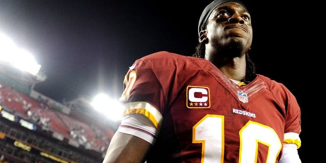 LANDOVER, MD - SEPTEMBER 09: Quarterback Robert Griffin III #10 of the Washington Redskins walks off the field after losing to the Philadelphia Eagles at FedExField on September 9, 2013 in Landover, Maryland. The Philadelphia Eagles won, 33-27. (Photo by Patrick Smith/Getty Images)