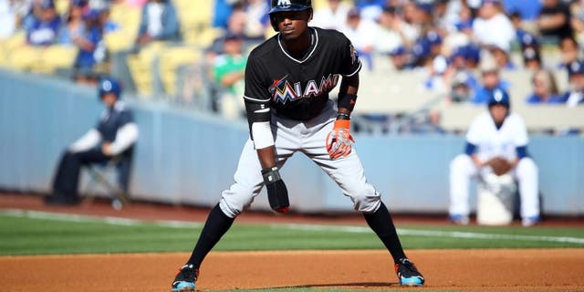 LOS ANGELES, CA - MAY 13: Dee Gordon #9 of the Miami Marlins leads off at first in the first inning during the MLB game against the Los Angeles Dodgers at Dodger Stadium on May 13, 2015 in Los Angeles, California. The Marlins defeated the Dodgers 5-4. (Photo by Victor Decolongon/Getty Images)