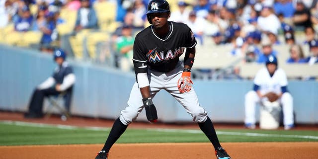 LOS ANGELES, CA - MAY 13: Dee Gordon #9 of the Miami Marlins leads off at first in the first inning during the MLB game against the Los Angeles Dodgers at Dodger Stadium on May 13, 2015 in Los Angeles, California. The Marlins defeated the Dodgers 5-4. (Photo by Victor Decolongon/Getty Images)