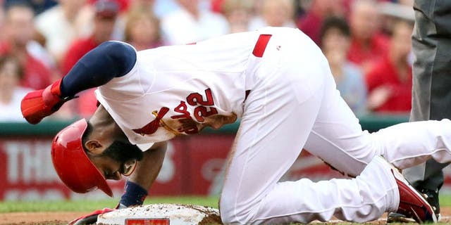 The St. Louis Cardinals' Jason Heyward pounds on the dirt after being thrown out trying to advance from first to third on a single by Yadier Molina in the first inning against the Pittsburgh Pirates on Thursday, Aug. 13, 2015, at Busch Stadium in St. Louis. The Pirates won, 10-5. (Chris Lee/St. Louis Post-Dispatch/TNS via Getty Images)