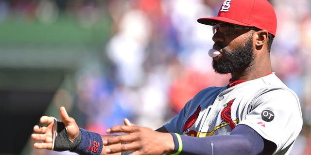 Sep 19, 2015; Chicago, IL, USA; St. Louis Cardinals right fielder Jason Heyward (22) stretches before the game between the Chicago Cubs and the St. Louis Cardinals at Wrigley Field. Mandatory Credit: Jasen Vinlove-USA TODAY Sports