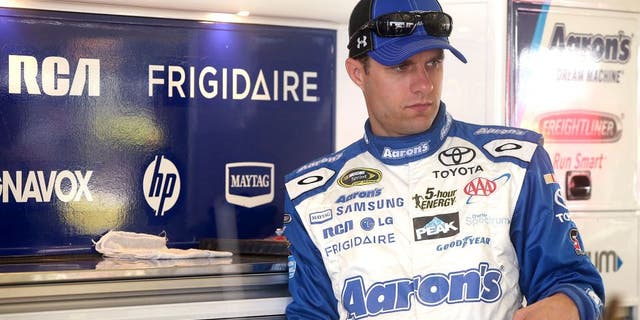 HOMESTEAD, FL - NOVEMBER 21: David Ragan, driver of the #55 Aaron's Online Dream Machine Toyota, stands in the garage area during practice for the NASCAR Sprint Cup Series Ford EcoBoost 400 at Homestead-Miami Speedway on November 21, 2015 in Homestead, Florida. (Photo by Sean Gardner/Getty Images)
