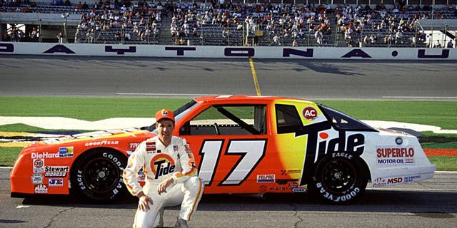 DAYTONA BEACH, FL - FEBRUARY 1989: Darrell Waltrip poses with the Rick Hendrick Chevrolet. (Photo by ISC Archives via Getty Images)