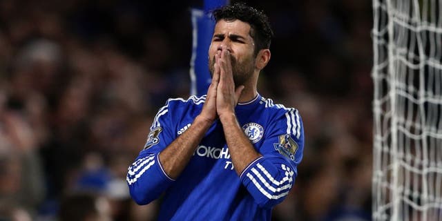 Chelsea's Brazilian-born Spanish striker Diego Costa reacts during the English Premier League football match between Chelsea and Bournemouth at Stamford Bridge in London on December 5, 2015. AFP PHOTO / JUSTIN TALLIS RESTRICTED TO EDITORIAL USE. No use with unauthorized audio, video, data, fixture lists, club/league logos or 'live' services. Online in-match use limited to 75 images, no video emulation. No use in betting, games or single club/league/player publications. / AFP / JUSTIN TALLIS (Photo credit should read JUSTIN TALLIS/AFP/Getty Images)