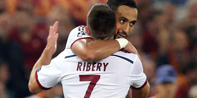 ROME, ITALY - OCTOBER 21: Mehdi Benatia (R) and Franck Ribery of Bayern Muenchen celebrate during the UEFA Champions League match between AS Roma and FC Bayern Munchen at Stadio Olimpico on October 21, 2014 in Rome, Italy (Photo by Maurizio Lagana/Getty Images)
