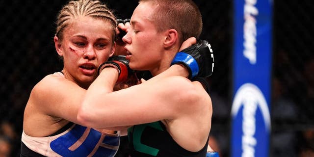 LAS VEGAS, NEVADA - DECEMBER 10: (R) Rose Namajunas clinches with Paige VanZant in their women's strawweight bout during the UFC Fight Night event at The Chelsea at the Cosmopolitan of Las Vegas on December 10, 2015 in Las Vegas, Nevada. (Photo by Jeff Bottari/Zuffa LLC/Zuffa LLC via Getty Images)