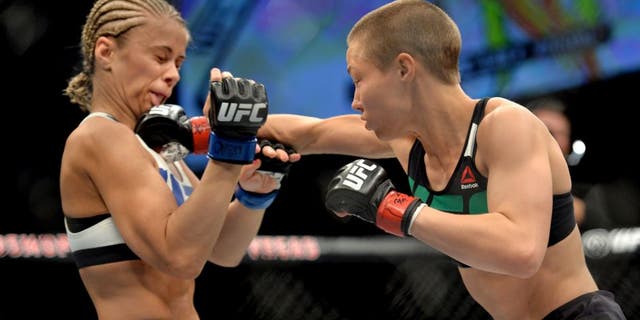 LAS VEGAS, NEVADA - DECEMBER 10: (R) Rose Namajunas punches Paige VanZant in their women's strawweight bout during the UFC Fight Night event at The Chelsea at the Cosmopolitan of Las Vegas on December 10, 2015 in Las Vegas, Nevada. (Photo by Brandon Magnus/Zuffa LLC/Zuffa LLC via Getty Images)