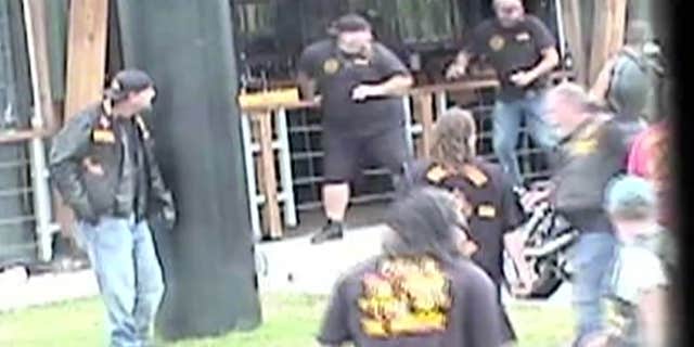 May 17, 2015: In this image made from Texas Department of Public Safety video, bikers run for cover as a shooting erupts outside a Twin Peaks restaurant in Waco, Texas.