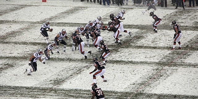 Dec. 12: New England Patriots quarterback Tom Brady (12) takes a snap from center in the first half an NFL football game against the Chicago Bears in Chicago.