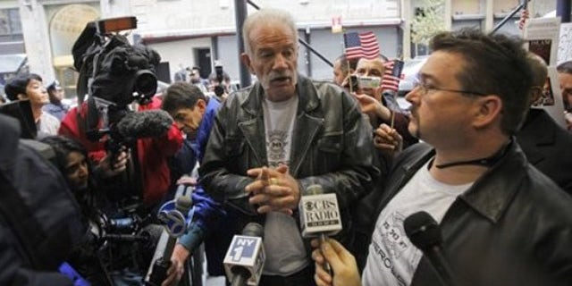 Nov. 16: Pastor Terry Jones, center, of the Dove World Outreach Center of Gainesville, Fla., speaks to reporters across the street from the proposed Islamic cultural center near the World Trade Center site in New York.