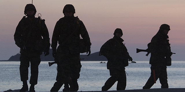Dec. 10: South Korean marines patrol along the beach of Yeonpyeong Island, South Korea.
