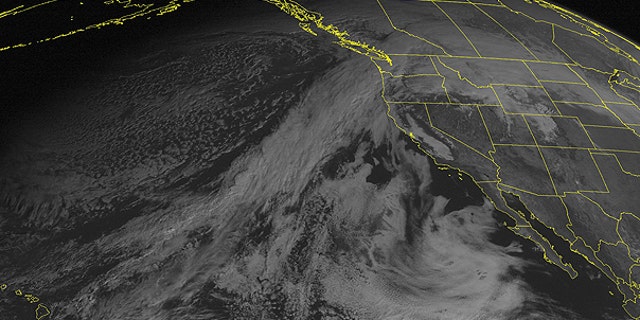 Dec. 12: This NOAA satellite image taken at 01:00 PM EST shows clouds streaming in from the eastern Pacific and spreading across the Northwest.