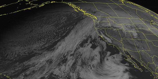 Dec. 12: This NOAA satellite image taken at 01:00 PM EST shows clouds streaming in from the eastern Pacific and spreading across the Northwest.