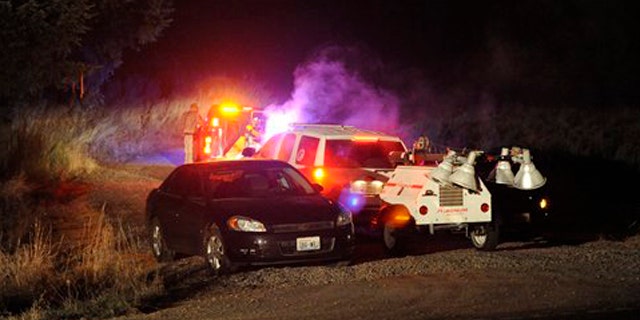 December 12, 2011: Crews enter the training area southwest of Joint Base Lewis-McChord, Wash., near the scene where two Army OH-58 Kiowa helicopters crashed, killing four soldiers.