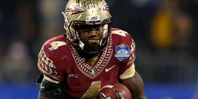CHARLOTTE, NC - DECEMBER 06: Dalvin Cook #4 of the Florida State Seminoles runs the ball against the Georgia Tech Yellow Jackets in the 3rd quarter during the ACC Championship game on December 6, 2014 in Charlotte, North Carolina. (Photo by Mike Ehrmann/Getty Images)