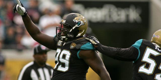 Dec 7, 2014; Jacksonville, FL, USA; Jacksonville Jaguars defensive tackle Sen'Derrick Marks (99) celebrates after a sack in the first quarter of their game against the Houston Texans at EverBank Field. Mandatory Credit: Phil Sears-USA TODAY Sports