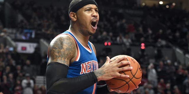 New York Knicks forward Carmelo Anthony (7) reacts to an officials call during the second half of an NBA basketball game against the Portland Trail Blazers in Portland, Ore., Saturday, Dec. 12, 2015. The Knicks won 112-110. (AP Photo/Steve Dykes)
